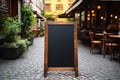 Mockup, advertising billboard near a cozy European restaurant or cafe. Cafe menu or pointer board for writing