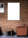 Mockup artist frame or white blank vertical poster on red brick wall background over the empty vintage brown single sofa seat. Royalty Free Stock Photo