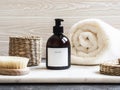 Mockup for bathing products in the bathroom, spa shampoo, shower gel, liquid soap with a towel beside and various accessories Royalty Free Stock Photo