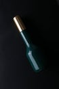 Mockup of black fragrance perfume bottle mockup on dark empty background. Top view. Horizontal Royalty Free Stock Photo