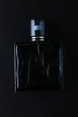 Mockup of black fragrance perfume bottle mockup on dark empty background. Top view. Horizontal Royalty Free Stock Photo