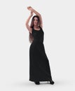 Mockup of a black loose long dress with an elasticated waist, on a posing beautiful girl in heels, isolated on background, front Royalty Free Stock Photo