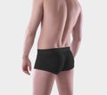 Mockup of black male boxers on the athletic body of a guy, brief underwear, isolated on background Royalty Free Stock Photo