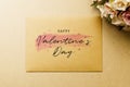 Mockup blank envelop on kraft paper for Valentine`s Day. Mock up for elegant design. Flat lay top view valentine`s day backgroun