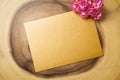 Mockup blank envelop on log wood for Valentine`s Day. Mock up for elegant design. Flat lay top view valentine`s day background