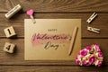 Mockup blank envelop on wood table for Valentine`s Day. Mock up for elegant design. Flat lay top view valentine`s day background