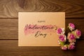 Mockup blank envelop on wood table for Valentine`s Day. Mock up for elegant design. Flat lay top view valentine`s day background