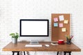 Mockup blank screen computer on wooden desk. desktop empty white screen, with workspace and office supplies on table Royalty Free Stock Photo