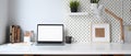 Mockup blank screen laptop and office supplies on white desk. Royalty Free Stock Photo