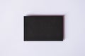 Mockup of blank textured black business card at white background Royalty Free Stock Photo