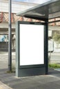 Mockup Blank vertical advertising billboard at a modern bus stop Royalty Free Stock Photo