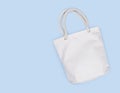 Mockup of blank white fabric bag isolated on blue background Royalty Free Stock Photo