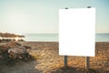 Mockup of blank white information board on sandy beach in summer, holiday vacation concept background Royalty Free Stock Photo