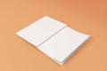 Mockup of blank white open brochure lying with cover upside on orange background Royalty Free Stock Photo