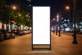 Mockup. Blank white vertical advertising banner billboard stand on the sidewalk at night