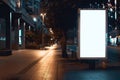 Mockup. Blank white vertical advertising banner billboard stand on the sidewalk at night Royalty Free Stock Photo