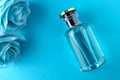 Mockup of blue fragrance with blue roses Female perfume beauty on a blue background