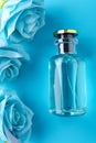 Mockup of blue fragrance with blue roses Female perfume beauty on a blue background