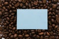 Mockup of a blue note on a solid background of coffee beans Royalty Free Stock Photo