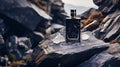 Mockup of a bottle of men's perfume standing on a stone Royalty Free Stock Photo