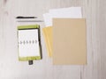 Mockup business brand template on wooden background. Set of stationery with notepad, recycled folder, paper, pen. Royalty Free Stock Photo