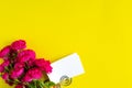 Mockup business cards on a colored background and a rose flower, copyspace, topview