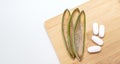 Mockup Capsules, Tablets And Green Leaf of Aloe Vera On Wooden Background. Concept Of