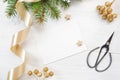 Mockup Christmas decor top view and gold ribbon, flatlay on a white wooden background, with place for your text Royalty Free Stock Photo