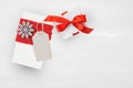 Mockup Christmas Gift Box and tag On Wooden Background With Snowflakes, Greeting card Merry Christmas and Happy New Year Royalty Free Stock Photo