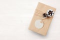 Mockup Christmas gift box wrapped in brown recycled paper and tied and tag sack rope with, top view Royalty Free Stock Photo