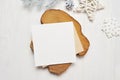 Mockup Christmas greeting card letter in envelope with white tree, flatlay on a white wooden background, with place for Royalty Free Stock Photo