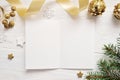 Mockup Christmas greeting card top view and gold star, flatlay on a white wooden background with a ribbon, with place Royalty Free Stock Photo