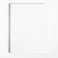 Mockup of closed blank square book at white textured paper background Royalty Free Stock Photo