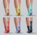 Mockup of colorful long gaiters on female legs, one foot stretched, back view, isolated on background. Set