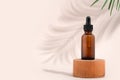 Mockup cosmetic face serum brown glass bottle with a pipette on a stylish minimalist