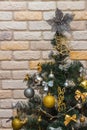 Mockup with decorated Christmas tree. Composition with gold and silver baubles, bows, animals, bells, lit garlands. Copy-space on Royalty Free Stock Photo