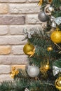 Mockup with decorated Christmas tree. Composition with gold and silver baubles, bows, animals, bells, lit garlands. Copy-space on Royalty Free Stock Photo