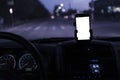 Mockup design of the smartphone attached to the windscreen inside the car Royalty Free Stock Photo