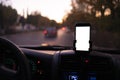 mockup design of the smartphone attached to the windscreen inside the car Royalty Free Stock Photo