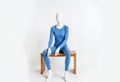 Mannequin Wearing Blue Thermal Underwear on Wooden Bench Royalty Free Stock Photo