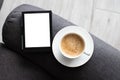 Mockup Ebook on modern armchair With Blank White Screen, to replace your design and Coffee for cozy atmosphere reading