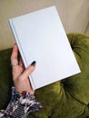 Mockup empty notebook book in women manicure hand background photo