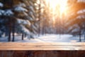 Mockup of empty wooden display product stand, table with blurred snow pine trees forest in morning sunlight, peaceful winter Royalty Free Stock Photo