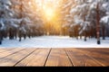 Mockup of empty wooden display product stand, table with blurred snow pine trees forest in morning sunlight, peaceful winter Royalty Free Stock Photo