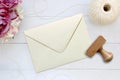 Mockup of envelope with a rubber stamp next to it. Royalty Free Stock Photo