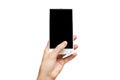 Mockup of female hand holding frameless cell phone with blank screen Royalty Free Stock Photo