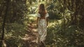 Mockup of a flowy bohemian dress on a model walking through a forest. Ideal for promoting your bohochic clothing line Royalty Free Stock Photo