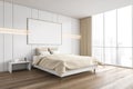 Mockup frame in beige wooden bedroom with bed and linens on parquet Royalty Free Stock Photo
