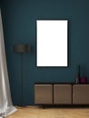 Mockup frame with blank frame, cabinet, floor lamp on dark teal painted wall Royalty Free Stock Photo