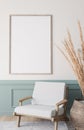 Mockup frame in bright living room design, vertical wooden frame on classic blue wall background
